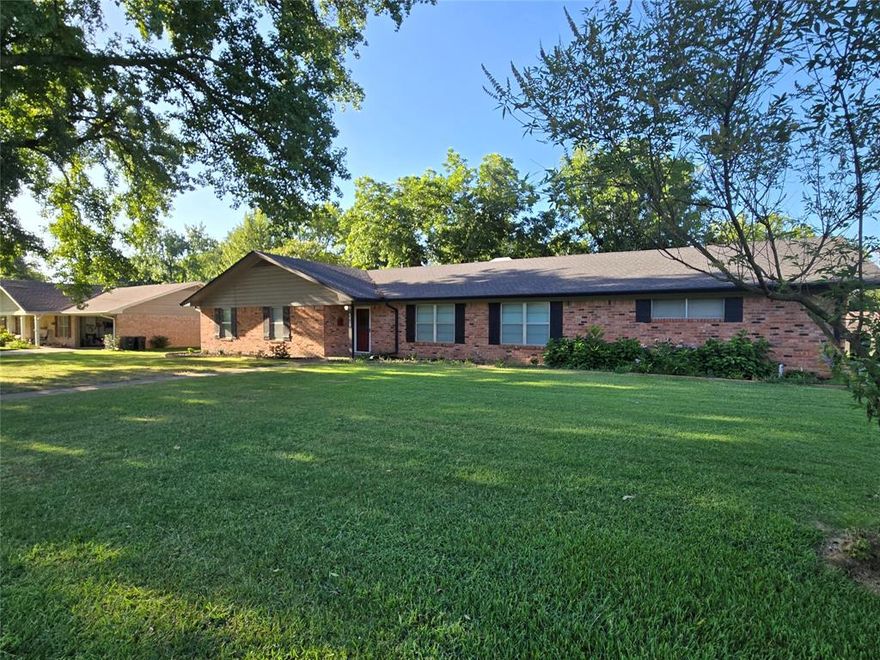 This inviting corner-lot residence in Sulphur Springs offers 3 bedrooms, 2 baths, and two generous living areas, providing a flexible layout for both everyday living and entertaining. Mature shade trees enhance the curb appeal and help keep the house cool during Texas summers. Inside you’ll find a wood-burning fireplace in the main living area, spacious bedrooms, and a large utility-laundry room for added convenience.

The kitchen features a breakfast bar and abundant cabinetry, with easy flow to a covered patio perfect for morning coffee or evening gatherings. The fully fenced backyard provides ample room for pets and play. Located in an established neighborhood just minutes from shopping, dining, and schools, this well-maintained home combines comfort, function, and location. Schedule your private tour today.