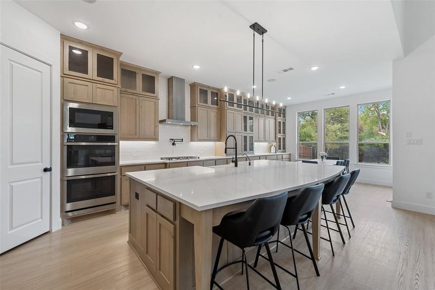 Experience elevated living in this breathtaking 5-bedroom, 4.5-bath Highland Home where timeless design meets modern sophistication. Thoughtfully designed for both everyday comfort and elegant entertaining, the home showcases soaring ceilings and expansive windows that flood the interiors with natural light. The inviting living area is anchored by a stately fireplace and offers picturesque views of the surrounding greenbelt. The gourmet kitchen is a chef’s dream, featuring built-in appliances, an oversized island, designer lighting, extended cabinetry, and abundant storage—perfect for both hosting and daily living. The serene primary retreat offers a private seating area and a spa-inspired ensuite bath complete with dual sinks, separate vanities, a freestanding soaking tub, rainfall shower, and an expansive walk-in closet. Generously sized secondary bedrooms and well-appointed baths provide comfort for family and guests alike. Entertainment is effortless with a first-floor media room and an upstairs game room, offering multiple spaces to gather and unwind. Step outside to a beautiful backyard overlooking the greenbelt, where the extended covered patio creates the perfect setting for outdoor dining and relaxation. Ideally located within the beautiful Sandbrock Ranch community offering excellent amenities, this exceptional home blends luxury, comfort, and lifestyle in one remarkable opportunity.
