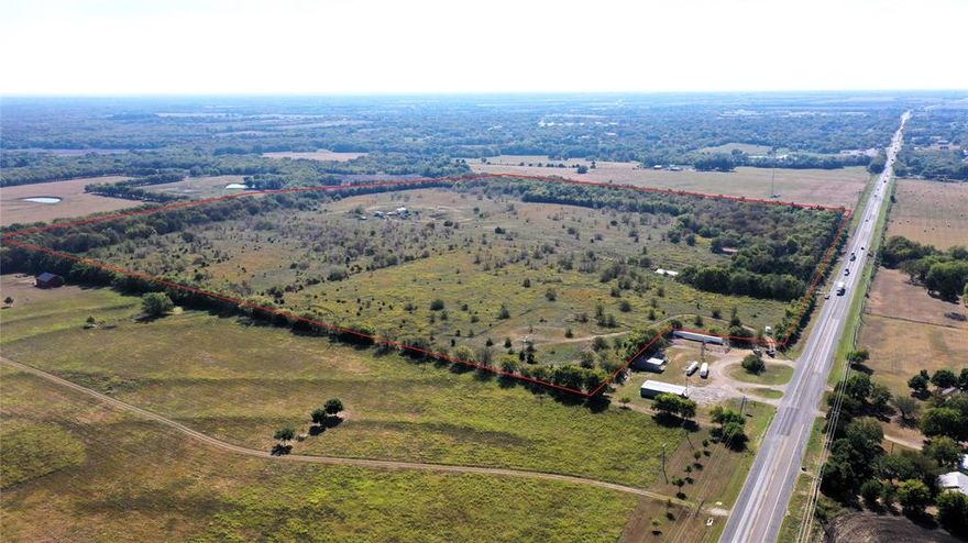 Motivated Seller. Nestled just north of Whitewright, Texas, this remarkable property offers a rare blend of location, potential, and income opportunity. With approximately 1,519 feet of frontage along the east side of US Highway 69, the land boasts exceptional visibility and access—ideal for investors considering future development or subdivision. The generous highway frontage opens the door to multiple split configurations, making it a versatile canvas for several different types of projects. There is a larger waterline in place for the possibility of multi water meters. 
The landscape is dotted with scattered trees, lending a natural charm to the acreage. Importantly, none of the property lies within a FEMA-designated floodplain, reducing development risk and simplifying planning. In addition, the property is teaming with wildlife.  While several structures stand on the land, they are considered to hold little or no value, offering a clean slate for new construction or redevelopment.
Adding to its appeal is a long-term lease agreement with Grayson County for a communication tower located on-site. This arrangement provides a steady stream of rental income, giving investors a built-in revenue source from day one.
Whether you're seeking a strategic investment, a development opportunity, or a property with passive income, this parcel delivers on all fronts.