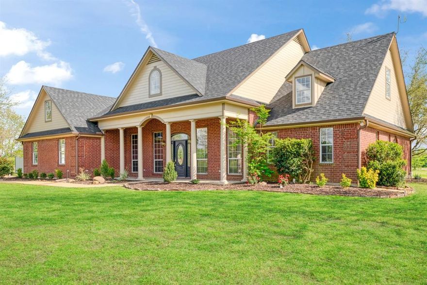 Stunning brick home and large shop with bay doors sitting on over 10 acres. This one owner country charmer features three large bedrooms, office, formal dining room, and two full baths and one half bath. Culinary dream kitchen with brand new appliances to include gas cooktop, double oven, and microwave air fryer.  Seat your guests at the breakfast bar with custom tile countertops, or in the breakfast room overlooking the country setting. Updated light fixtures with LED lighting and newly installed window panes with refurbished screens. Interior also has classic features to include an entryway chandelier as well as a chandelier in the formal dining room, and crown molding throughout. Spacious living area with high ceilings, gas log fireplace, surround sound and custom woodwork built -ins great for displaying fine art, or double as a library. The study features a built in custom roll-top desk with shelving to the ceiling. Custom wood flooring throughout entry, dining room, kitchen, breakfast room and study. 

Luxury at its finest is found in the primary bath to include walk in shower, soaking tub, new tile flooring, and custom vanity; primary area are serviced by on demand gas water heater. Enjoy peace of mind with the new 30 year shingled roof and warranties. Shop features include 45x40 concrete slab work area, new insulation, electric for RV hookups, and lots of built-ins to accommodate any handy-work or hobby. Shop also has 3 bay doors, electricity, 40 x15 lean to and ramps for entry and exit. Experience the view of Whitetail deer traveling nearby on your custom stone back patio under a canopy of large Live Oaks. This house checks all the boxes, full list of updates in associated documents. These fine estates don't come available often so don't miss out! No known deed restrictions.