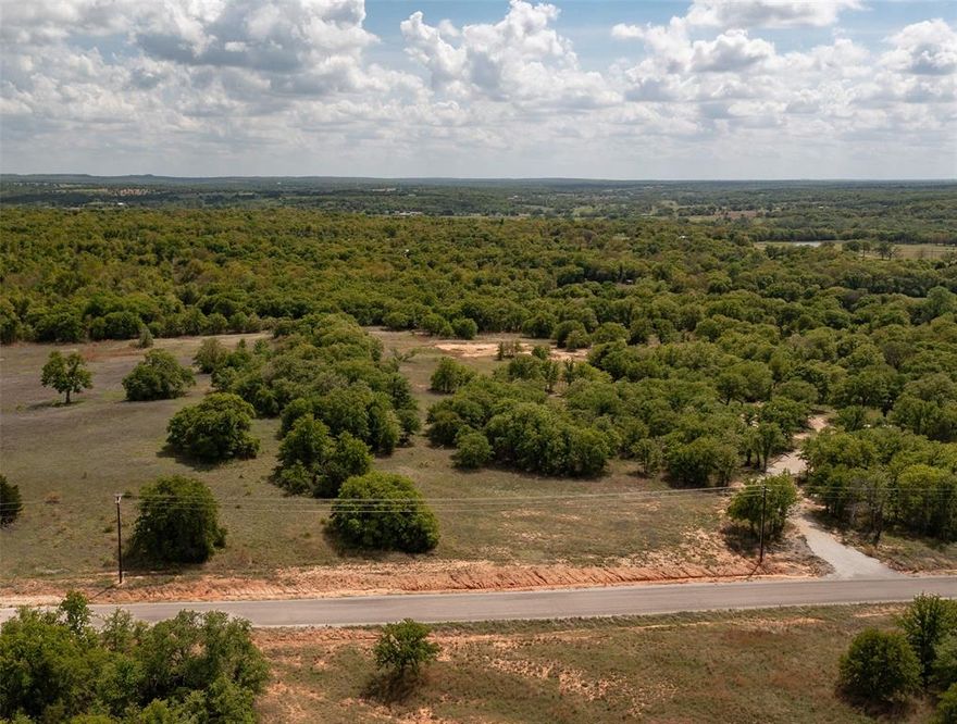 Welcome to Lot # 8 of Red Oak Hills, conveniently located between the historic towns of Nocona and St. Jo with easy access back to highway 82.  This 5 acre tract offers a gentle rise from the road to the interior of the property before transitioning to a gradual downward slope as you move to the rear of the property.  These natural slopes offer great drainage with no need for drainage easements on this property.  A nice balance of open spaces and pockets of dense trees allow for a feel of being on a larger tract of land.  This would be a great site to build your future home with restrictions in place to protect your investment.  Electric runs along the road.  Imagine sitting on your porch or next to a window sipping your beverage of choice while watching the deer frolic or the turkey strut.  Your piece of North Texas hill county awaits.