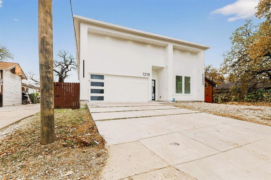 $0 down loan options available for this property!! Welcome to this exceptional contemporary home featuring 3 bedrooms and 3 full bathrooms, perfectly positioned near downtown Dallas and surrounded by exciting new development. Designed with modern living in mind, the home offers a thoughtfully customized walk-in pantry for effortless organization, along with sleek 10-inch cabinet hardware that adds a refined, upscale touch throughout. The primary suite is a true retreat, boasting a spa-inspired bathroom highlighted by elegant ceramic tile, a luxurious double-headed elongated shower, and an oversized garden tub ideal for unwinding after a long day. Every detail of this residence reflects quality craftsmanship and intentional design, setting it apart as a standout property in the neighborhood. With its prime location, contemporary finishes, and attention to detail, this home presents a rare opportunity you won’t want to miss. Schedule your showing today—this one won’t last long.