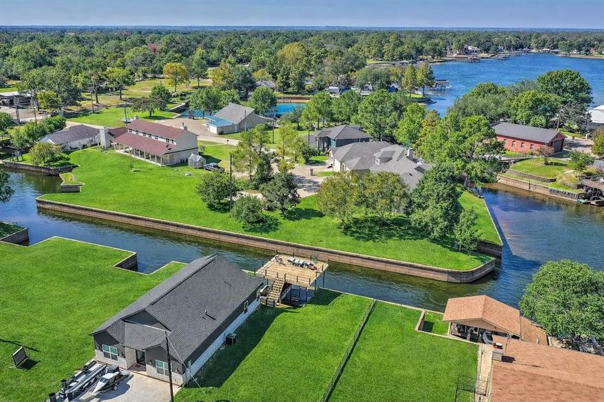 Hilltop Escape is a luxury waterfront retreat in the sought-after Treasure Isle community on the clear southern end of Cedar Creek Lake, known for excellent fishing and exceptional water quality. This recently built modern farmhouse features upscale finishes, soaring vaulted beam ceilings, abundant natural light, and a split-bedroom floor plan designed for privacy and comfort. The waterside primary suite includes a spa-inspired bath with a soaking tub, separate shower, dual vanities, and a spacious walk-in closet, while the chef’s kitchen showcases quartz countertops, premium appliances, and an oversized island ideal for entertaining. Outdoor living includes peaceful cove views from the covered patio and an expansive party deck above the private boathouse. Located in a site-built-only community with four-vehicle parking, the home sits approximately 80 minutes from Far North Dallas, making it an ideal lock-and-leave weekend retreat. With a strong short-term rental history on Airbnb and VRBO, and furnishings, boats, and recreational equipment available for purchase, Hilltop Escape is a turnkey lakefront opportunity.