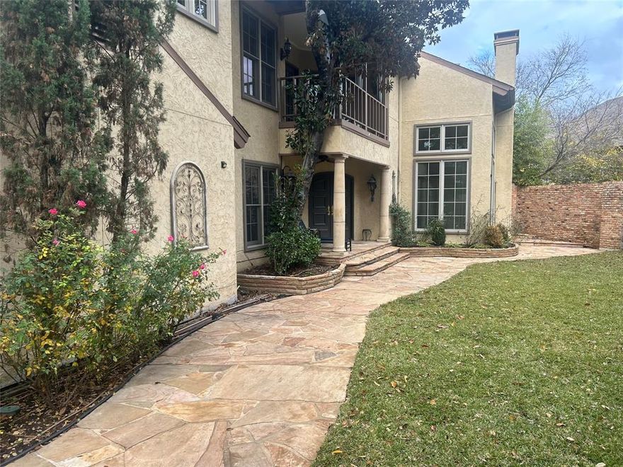 This rarely available Bluffview townhome located in the highly desirable Cochran Chapel Circle, was withdrawn from the market for much of 2025 to complete major exterior renovations including a new roof.  This is one of the largest townhomes in the community both in square footage and lot size and is now priced to sell!  This home offers a large private yard with newly installed sodded grass as well as an additional separate back patio and yard featuring zero maintenance artificial grass. Updates include quartz countertops and backsplash in kitchen and wet bar, stainless steel appliances, gas cooktop and double ovens, freshly sanded and stained hardwoods in the living room, fresh sodded grass as well as artificial grass in the backyard. A radiant barrier in the attic keeps energy bills low. A brand new electric panel was recently added. The property features French drains, 2 water heaters that were replaced in the last 5 years with an emergency drainage system, an owned Security System and much more!
