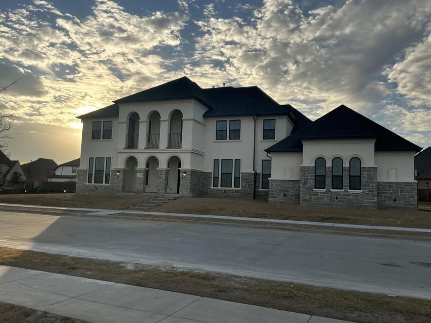 MLS# 21130915 - Built by Drees Custom Homes - Mar 2026 completion! ~ This stunning contemporary 5-bedroom, 6-bath, 4 car garage, single-family residence, set to be completed by March 2026, offers an expansive 4,989 square feet of luxurious living space in the desirable Viridian subdivision. Each of the five bedrooms includes its own private bath, ensuring ultimate comfort and convenience. The open floorplan features three spacious living areas, two dining areas, and decorative lighting throughout. A gourmet kitchen with a large island and pantry caters to culinary enthusiasts, while two cozy fireplaces enhance the atmosphere. Enjoy outdoor living on the balcony or covered patio overlooking scenic water and greenbelt views. Additional highlights include ENERGY STAR heating and cooling systems, vaulted ceilings, and a four-car garage. Located in the highly regarded Arlington ISD, with proximity to Viridian Elementary, and Trinity High School, this home is an exceptional opportunity for modern living.