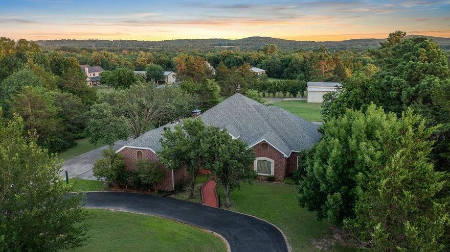 *MOTIVATED SELLERS*Searching for that perfect blend of comfort, space, and functionality? Welcome to this meticulously maintained custom home that truly has it all, acreage, a shop, outstanding outdoor entertaining spaces, and so much more! This impressive 4-bedroom, 2.5-bath home offers a thoughtfully designed floorplan on a peaceful 1.168-acre lot, just minutes from Hwy 75, yet tucked away on a quiet, dead-end county road in an established neighborhood. Located just outside city limits, you’ll enjoy the added perk of NO CITY TAXES! Inside, you'll discover a spacious and inviting layout with two expansive living areas, a dining room, and a kitchen that’s truly the heart of the home. Featuring an oversized island, breakfast bar, and a plethora of custom cabinetry, the kitchen provides ample space for hosting, cooking, and gathering. The exterior is what sets this property apart. The large 40x40 workshop with electricity and 3 roll up doors is a dream for all the hobbies or small business owners. Need RV parking? You’ve got it!  There's a 20x40  covered space ready to go. A full storm shelter offers added peace of mind, while the circle drive provides ultimate convenience. The covered back porch is made for entertaining, ideal for hosting BBQs, watching the sunset, or simply relaxing after a long day. The backyard offers plenty of room to roam, garden, or even add a pool. Plus, there’s stair-accessed attic storage stretching the full length of the 2-car garage for all your seasonal and overflow storage needs. Whether you're entertaining guests, working on weekend projects, or just enjoying the quiet of country living with close-to-town convenience, this home delivers it all. Make your appointment today to view this home!