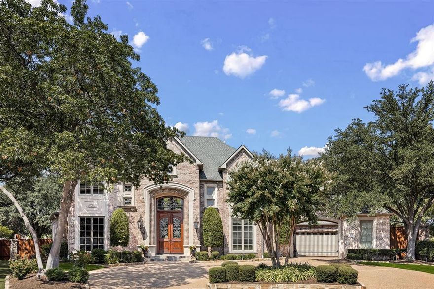 Nestled on a private cul-de-sac lot, this magnificent home offers a perfect balance of grand living & relaxed elegance, all set against the breathtaking backdrop of Gleneagles golf course and a tranquil lake. Your journey begins by stepping through custom leaded glass doors into a spectacular entry defined by a majestic double staircase and mosaic tile. Living room features a cathedral ceiling and stunning wall of windows that frame the golf course & sparkling pool. It’s an ideal setting for both quiet evenings and grand celebrations. Automated Lutron shades & lighting throughout allow you to effortlessly set the perfect ambiance. Outside is your private outdoor oasis, where a sparkling pool & spa seem to merge with manicured greens. Built-in grill & refrigerator make al fresco dining a pleasure, while the expansive wrap-around lake view adds serenity. Gourmet kitchen is a chef's dream, featuring a large island, Sub-Zero refrigerator, Wolf commercial gas range, and dual convection ovens. Enjoy casual meals in the breakfast nook with a charming built-in banquette. Den provides a cozy retreat with its golf course views, while the elegant dining room, with its butler's pantry and chandelier, is ready for formal gatherings. Primary suite is a peaceful escape with a sitting area that overlooks the golf course. Spa-like primary bath elevates relaxation to an art form, featuring a spacious walk-in shower, a hydro-tub, and a see-through electric fireplace that connects to the bedroom. The custom closet is a room in itself, with a center island and built-in dressers topped with granite. Game & media room is the ultimate destination for fun, with bar, refrigerator, and attached arcade room. Study provides a perfect space for focus, complete with a wet bar and a wall of built-ins. Practicality is not forgotten, with a walk-in attic, large storage closet, front & back staircases, and safe room for peace of mind. Every detail of this home is designed to enrich your lifestyle.