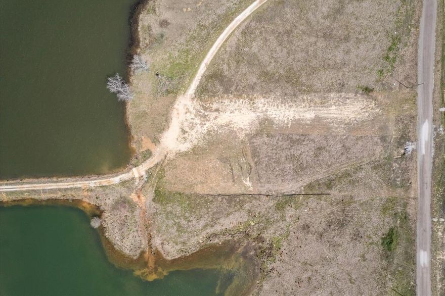 Discover the serenity of lakeside living with this vacant lot, poised perfectly for constructing your dream waterfront residence on the shores of Lake Renshaw. Envision awakening to the soothing symphony of nature, stepping out into a morning where the tranquil waters invite an early catch or a reflective pause. The promise of reeling in large-mouth bass right from the convenience of your backyard transforms this locale into an angler’s paradise.

This expansive plot offers not just a place to build, but a canvas to craft your ideal weekend hideaway or a full-time sanctuary amidst the splendor of East Texas. Privileged with direct waterfront access, your future home will be a gateway to aquatic adventures.

Nestled within the welcoming community of Big Sandy, this property marries the quaint charm of countryside living with the accessibility of modern conveniences. 

Create your retreat where peace meets possibility, and every day ends with a view that’s painted not just with colors, but with the dreams of lakeside living. This is not merely a place to live, but a place to thrive, a secret haven that awaits your discovery and flair to transform it into a home. Indulge in the symphony of nature, and let your lakeside dream take root here.

TAXES:  SOURCE COUNTY APPRAISAL DISTRICT