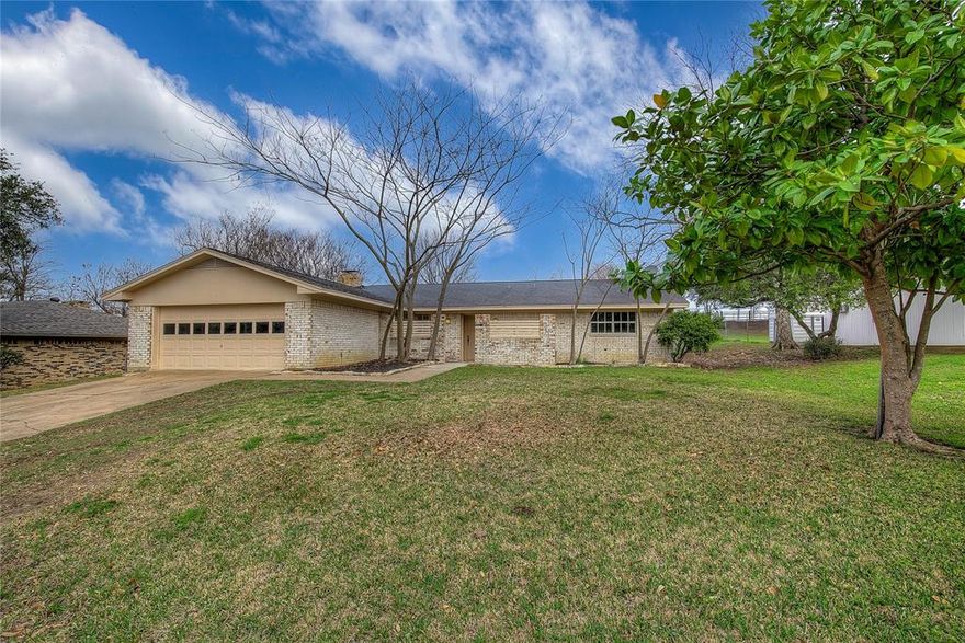 A great place to call home, friendly neighborhood, Wide street with quick access to down-town, as well as East Texas A&M university. The home feels spacious and welcoming with an Extra large living room with a show stopping functioning fireplace, with built-ins as well as raised ceilings in the living room and kitchen. Larger than average bedrooms and closets. Recently painted Bedrooms. Large back back patio with extended Patio cover, beautiful trees, No homes located behind the house. Fenced in backyard, it has a warm and inviting feeling that will last for years and bring comfort and security to all who call it home. Recent work performed, refurbished air handler coils, blow in attic insulation, painted bedrooms and exterior.