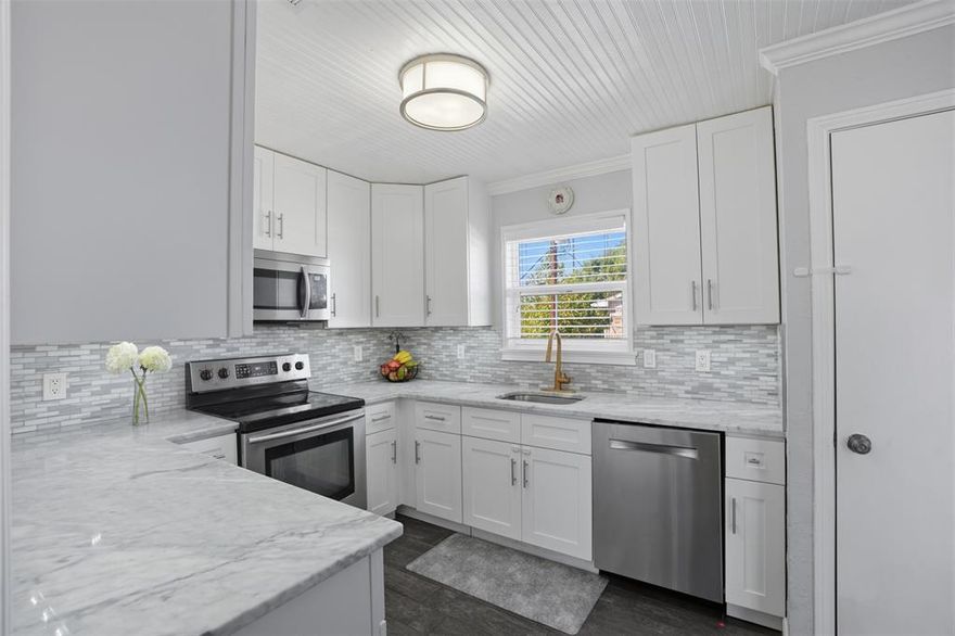 This beautiful second-floor end unit has been completely renovated and shows like a model home. Located in a prime neighborhood on the outskirts of Park Cities, this condo has community pool access, is move-in ready and is packed with upscale finishes.

Updates include: Wood-look ceramic tile flooring throughout, stylish details like wainscoting, chair rail, and beadboard ceiling, stainless steel appliances and modern lighting fixtures. Frameless glass shower door and Nest thermostat. Faux wood blinds and upgraded hardware. Energy efficient Low-E windows. Both bedrooms feature generous walk-in closets. HUGE private patio balcony makes for great outdoor
entertaining. Two covered carport spaces lead directly to the building's back entrance—just steps from your door for easy access with groceries or gear. Unbeatable location is walkable to Central Market, Starbucks, and tons of restaurants, bars, and shopping. You're close to SMU, DART, and Mockingbird Station, with easy access to the Katy Trail Extension and White Rock Lake for biking, running, or weekend adventures. This one checks all the boxes—style, convenience, and a lifestyle location you'll love.