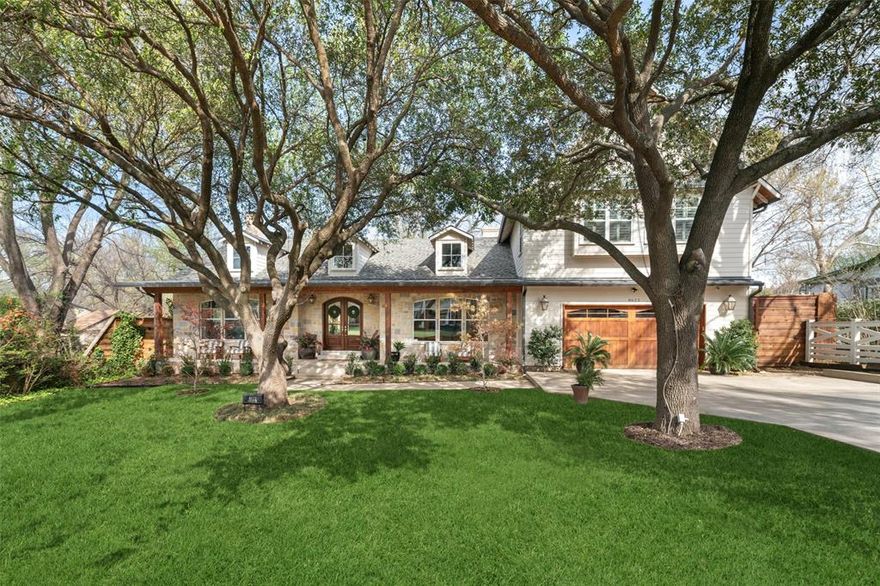 Set on an oversized, tree-filled lot on a country-style lane, this beautifully designed 6-bedroom, 5-bath home offers the ideal blend of space, functionality, and charm in the heart of Bluffview (Shorecrest Estates). Desirable pier-and-beam construction elevates the home above an expansive backyard, complete with a 900+ sf deck for al fresco dining or sitting by the fire. A welcoming front porch leads into generous living space designed for both everyday living and entertaining. The main level features a formal dining room, formal living or study, and a spacious living area that flows seamlessly into the gourmet kitchen. Outfitted with premium Sub-Zero, Dacor and Samsung appliances, a large center island, and ample storage, the kitchen offers a clean, functional layout and sweeping views of the backyard. Tucked privately at the rear of the home, the primary suite offers a true retreat with its own fireplace and direct access to the charming backyard deck. A secondary guest suite is also on the first floor, along with a butler's pantry and fully upgraded laundry room featuring custom cabinetry and new tile. A wall of custom cabinets behind the kitchen provides flexible storage alongside a full beverage center. Upstairs, a spacious second living area, enhanced with a wet bar with fridge, icemaker and dishwasher, opens to the rooftop outdoor deck. Four additional bedrooms and a versatile bonus room, ideal for a media room, playroom, or home office, provide flexibility for a variety of lifestyles and needs. Additional features include Ecobee smart thermostats, app-enabled security system, fully hardwired video monitoring system and a new front fence already wired for an electric gate. Sought-after public and private schools, and the shops and dining of Lovers Ln. are just a short drive away. With incredible outdoor living space in a peaceful, private setting, this move-in-ready home offers an exceptional opportunity in one of the city's most picturesque neighborhoods.