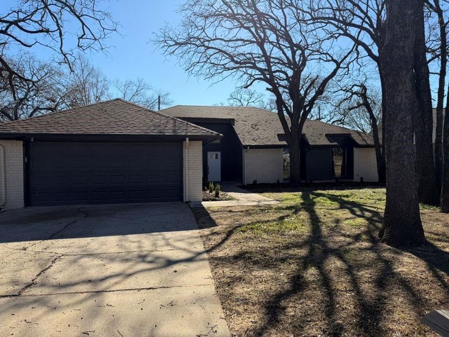 5206 Wind Rock Ct in Arlington TX is a single family residential property that has undergone a complete home renovation. Updates include new flooring throughout, remodeled bathrooms, refreshed interior paint, and updated appliances. The roof has been replaced within the last four years and the hot water heater has been replaced within the last two years. The property is located within the Arlington ISD attendance zone and is situated on a lot with established mature trees. The home is vacant and ready for occupancy.