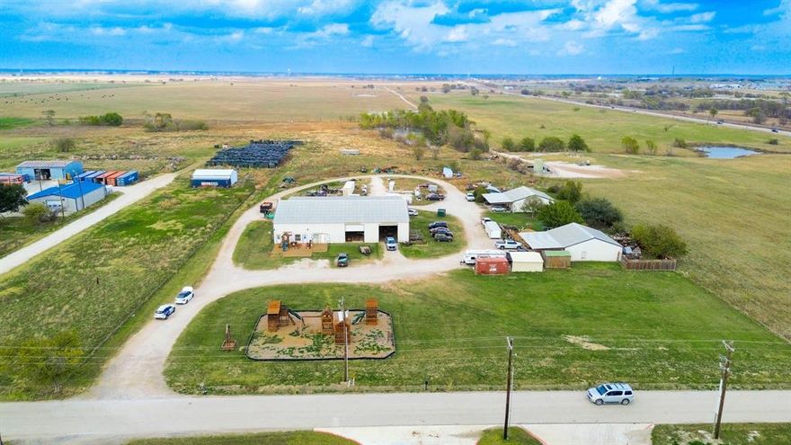 Pleased to present 14.82 acres of land for sale, featuring existing income-producing light industrial improvements. The property is anchored by 13,280 SF of industrial structures leased to Backyard Fun Factory, a long-established manufacturer of high-quality wooden playsets. The main improvements include a 100’ x 100’ shop with a dust-venting system, office space, three roll-up doors, and four walk-through doors. Two additional 40’ x 40’ buildings, each with central electric heating and cooling and dual walk-through doors, support ongoing operations and provide versatile functionality. All structures are fully serviced with city water, septic, and electric. The 14.82-acre site offers substantial land for new development, property expansion, outdoor storage, or complementary facilities. A pond behind the existing buildings presents additional development potential with the option to be filled in. With stable tenancy, functional infrastructure, and significant long-term growth capacity, this property is an ideal opportunity for investors seeking a versatile land asset with immediate rental income and future upside.