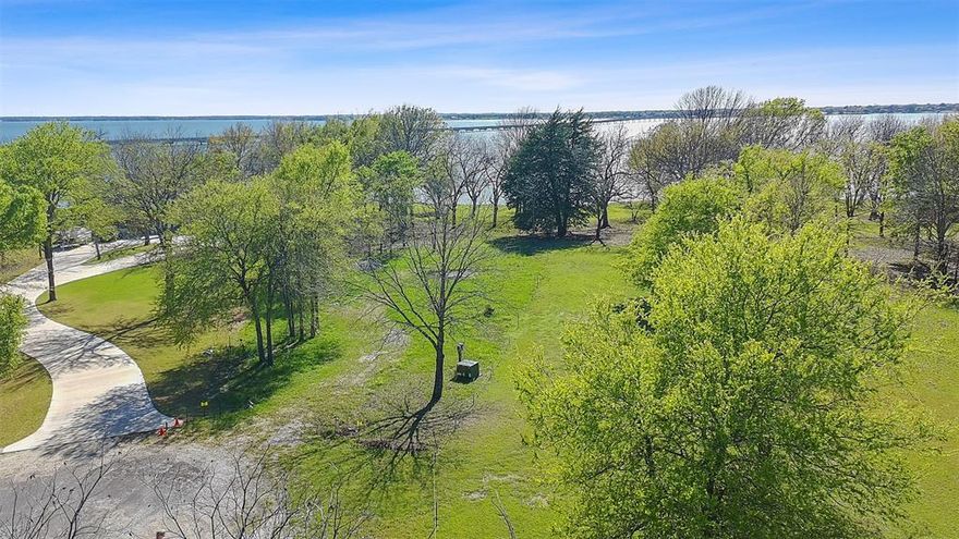 Beautiful waterfront lot located on the open waters of Richland Chambers Lake, offering a peaceful setting with scenic views and direct access to lake living. Situated at the end of a cul de sac, this property provides a sense of privacy while still being part of an established community.
The lot features mature trees that add natural shade and character, along with a retaining wall already in place to help protect the shoreline and enhance usability. With open water views and ample space to build, this property presents a great opportunity to design a custom lake home or weekend retreat. Enjoy fishing, boating, and relaxing lakefront sunsets from your own backyard. Conveniently located with easy access to local amenities while still offering the quiet atmosphere that makes Richland Chambers Lake such a desirable destination.