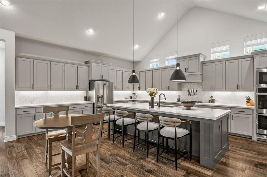 This stunning Perry Home is situated on a generous .26-acre lot in sought-after Canyon Falls Village and priced incredibly well. Perfectly blending sophisticated design with a warm, inviting ambiance, this residence is ideal for those seeking luxury, comfort, & convenience in a neighborhood that truly feels like home. 

This home offers four spacious ensuite bedrooms. Each bedroom provides a private retreat with its own dedicated bathroom, offering ultimate comfort for family & guests alike. The home is modern, with a lofty design & warm finishes. It also features soaring ceilings, abundant natural light, & open-concept living spaces that strike the perfect balance between sleek modern style & cozy elegance. Pay attention to the engineered wood floors as you tour the home. They are durable, beautiful & seamlessly flow throughout the main living spaces, adding timeless sophistication to the interior. This chef's kitchen is perfectly designed for entertaining AND everyday living; featuring premium finishes, abundant cabinetry, & high-end appliances to inspire your inner chef. The three-car tandem garage, with epoxy finish, includes a 100 sq. ft. bump-out for additional storage...perfect for hobbies, sports equipment, or your refrigerator or deep freezer. This stunning home backs to a serene green space & delivers rare privacy & a beautiful natural backdrop for morning coffee or evening gatherings. 
 
Located in a newer, diverse, & walkable community, this home offers easy access to top-rated Argyle ISD schools (see photos), scenic walking trails, parks, & a variety of nearby amenities—all just steps away from your front door. While Argyle maintains its small-town charm & peaceful surroundings, it’s also growing thoughtfully, featuring essential commercial conveniences that make daily living effortless without sacrificing the tranquil feel of the area. Argyle itself remains a hidden treasure in North Texas. Come see for yourself!