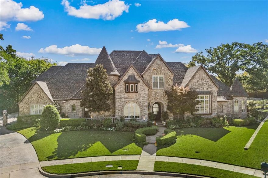 Discover unparalleled luxury in this custom-built home, nestled on an oversized treed lot within the prestigious Palomar Estates. Impeccably maintained & thoughtfully updated, this home is a perfect blend of timeless elegance & modern convenience, offering an exquisite lifestyle in one of the most sought-after neighborhoods.
As you step inside, you'll be welcomed by a stunning open layout, with attention to detail apparent in every corner. The gourmet kitchen is a chef's dream, complete with built-in refrigerator, 8-burner Wolf gas range, 2 Miele dishwashers, & double islands, providing both functionality & elegance. The enlarged pantry offers abundant storage space, while the glass-front cabinets lend a refined touch to the kitchen’s sleek aesthetics.
The luxurious primary suite is a true retreat, with serene views of the beautifully landscaped backyard. Wake up to peaceful mornings in this private haven, complete with cozy fireplace & remote controlled blinds. An elegant study completes the 1st level.
On the 2nd level 3 spacious beds all with ensuite baths, a large game room & an impressive media room with wet bar, for family fun & entertainment await you. Additionally, a nursery & a private study area have been added to provide flexibility & cater to your unique lifestyle needs, offering quiet spaces for both work & relaxation.
Step outside to your private outdoor oasis. A luxurious pool & spa, surrounded by multiple seating areas, invite you to relax & enjoy the gorgeous landscaping in tranquility. Gather around the firepit perfect for cozy evenings under the stars. 
For golf enthusiasts, a putting green offers a fun, unique feature right in your own backyard. The fenced yard ensures complete privacy, making it a perfect spot for entertaining or unwinding in peace.
This exceptional home offers a lifestyle of luxury and privacy, all while being close to top-rated CARROLL ISD, shopping, and dining. 
Experience the perfect blend of elegance & comfort.