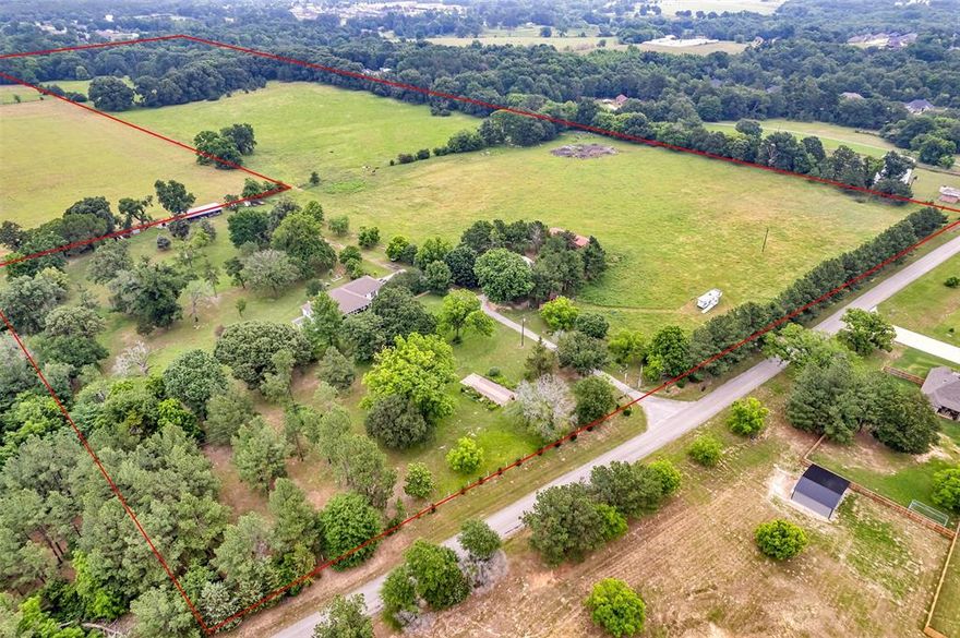 Located in the Growth Corridor of Lindale ISD, this exceptional 52± acre property offers privacy, functionality, and convenience just minutes from the City of Lindale. The land features a well-maintained 2,178 sq ft residence surrounded by mature shade trees and landscaped gardens, creating a peaceful East Texas setting.

The home offers an open and spacious living area with a practical split-bedroom floor plan, ideal for everyday living and entertaining. Covered front and rear porches provide inviting spaces to enjoy morning coffee or unwind in the evenings while taking in the surrounding views.

Property Highlights:
52± acres with open and usable terrain. 
2,178 sq ft home. 
3 bedrooms, 2 bathrooms. 
Open-concept living area. 
Split-bedroom layout. 
Covered porches. 
Barn and multiple storage sheds. 
Cross-fencing in place. 
Water well for irrigation and livestock. 

This versatile tract offers excellent future potential, including the ability to divide the acreage to suit a variety of uses such as agricultural, residential, or investment purposes.

A rare opportunity to own a sizable acreage in Lindale ISD that combines rural charm with close proximity to schools, shopping, and dining.