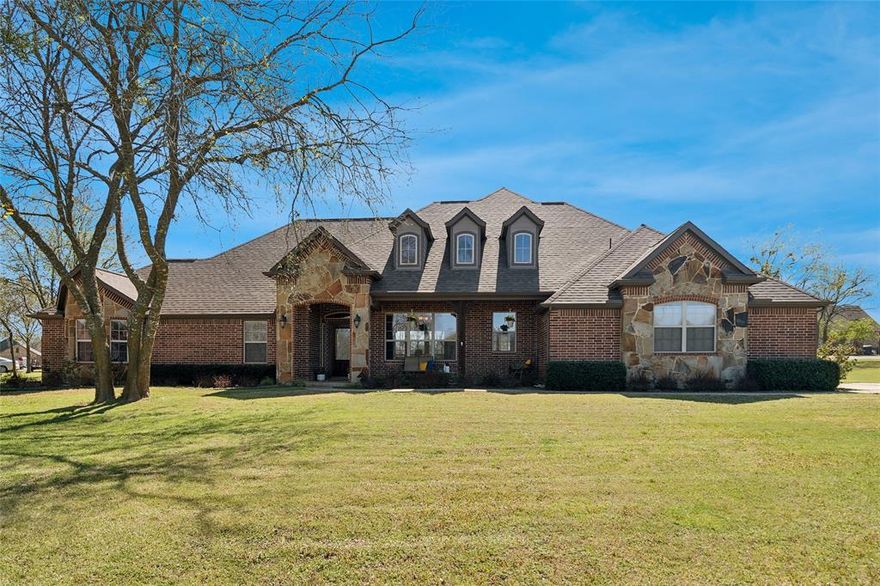 PEACEFUL !!!!  Custom single-story home in beautiful Hidden Lakes Ranch community. Numerous lakes though-out the neighborhood and there is a fishing dock practically out your back door. Lots of privacy on the 1 acre+ lot.  Corner stone fireplace in living room greets you as you enter this open floor plan. The dining room, living room, kitchen and breakfast room flow together seamlessly. The kitchen features custom knotty alder cabinets and an enormous pantry!!! A separate family room with windows galore is cozy, yet gives you a fabulous view of your yard and Mother Nature's offering of the season. The primary bedroom wing is tucked away from the other bedrooms and offers peace and quite with a sitting area, barn doors, a sunken tub, separate shower and separate vanities. The over-sized secondary bedrooms have large closets. (One of the bedrooms is currently being used as an office.) Hardwood floors and tile in wet areas.....no carpet! Enjoy your little piece of heaven on the front porch or from the covered back patio. This home has been meticulously maintained and is move-in ready! We are ready for you to visit and fall in love!!!