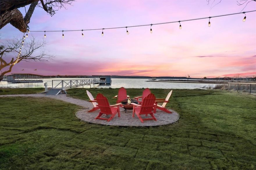 Welcome to your dream lake retreat on the shores of Possum Kingdom Lake. This rare one story barndominium style estate blends modern design with the laid back charm of lake living and comes fully furnished and ready to enjoy. The main home features four spacious bedrooms and four baths with an open layout that makes entertaining effortless. The kitchen offers sleek quartz countertops, crisp cabinetry, and a large island that flows into the living and dining spaces where tall ceilings, wood beams, and a stone fireplace create a warm gathering place.

Step outside to the screened in patio where you can dine or relax while taking in views of the water. A 140 foot walkway leads to the private covered dock complete with an automatic boat lift, two jet ski lifts, and lockable storage. Evenings are best spent by the fire pit under string lights or soaking in the hot tub while watching unforgettable sunsets.

Guests will love the private three bedroom two bath guest house, making this property ideal for hosting friends and family or for use as a short term rental. With room to comfortably sleep sixteen and a strong rental history, it is both a personal getaway and a SMART investment.

Additional highlights include a fully fenced lot with custom cedar automatic gate, fresh sod with sprinkler system, spray foam insulation for energy efficiency, and a massive 1400 square foot garage perfect for hobbies or game nights with space for a dart board and basketball hoop.

Located just minutes from dining, live music, Rocker B Ranch, golf, and all the attractions of Possum Kingdom Lake, this home offers a lifestyle like no other. Life is better by the water and this property makes every day feel like a vacation.

As of Sept 19 this has grossed $160,000 from STR for 2025. Please reach out to Brooke for updated numbers.