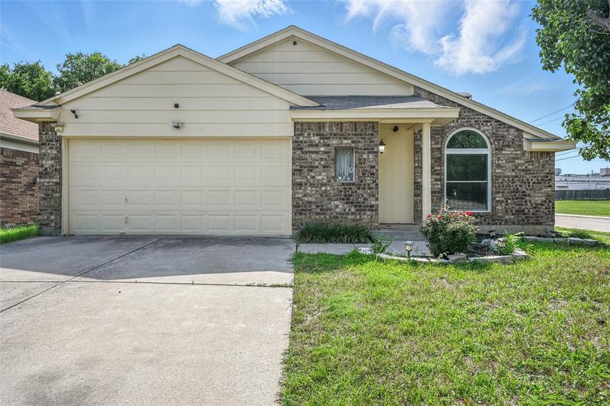 Welcome to your charming retreat in the heart of Keller ISD! This beautifully maintained home sits on a spacious corner lot with no HOA, offering added privacy and a serene setting that backs to a peaceful creek and church. The sparkling pool is perfect for summer days, and the location provides easy access to parks, playgrounds, shopping, and dining. Inside, you’ll find a warm and inviting layout with vaulted ceilings, tile flooring throughout the main living areas, and cozy carpet in the bedrooms. The living room features a striking stone wood-burning fireplace and classic picture frame and chair rail molding, creating an elegant yet comfortable space for everyday living or entertaining.  The kitchen is a true highlight, showcasing granite countertops, a tumbled marble backsplash with decorative glass tile accents, a stainless steel sink, and a breakfast bar. The Samsung 5-burner cooktop and oven, stainless steel dishwasher, and updated disposal offer both style and functionality. The spacious primary suite includes high ceilings, a walk-in closet, and a spa-like bathroom featuring granite countertops, glass accent tile, a relaxing garden tub, and an updated separate shower completed in 2022. Both bathrooms have been tastefully upgraded with granite surfaces and stylish finishes. In the backyard, you will find a well-maintained swimming pool features crystal-clear water and a brand-new, energy-efficient pump for optimal circulation. Recently serviced and ready to enjoy, it's perfect for relaxing or entertaining. This lovingly cared-for home offers comfort, convenience, and character in an unbeatable location. Don’t miss your opportunity to make it yours!