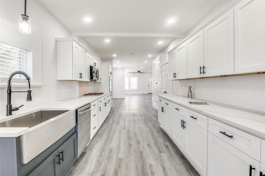 This beautiful home has been completely renovated. The renovation includes a new electrical system, new plumbing throughout, all new lighting and plumbing fixtures, new HVAC, new water heater, all new Sheetrock, new flooring throughout highlighted by a freshly painted interior. The kitchen has ALL new appliances from the gas cooktop to the electric double oven, microwave, dishwasher and garbage disposal surrounded by new cabinets, quartz countertops and a framers sink.  The living room has a wood burning fireplace with a gas starter. As you exit either set of the French doors at the rear of the home, you will walk on a new 14X10 deck overlooking the large backyard.  This is a home you will want to share with your buyers.  
(ALL work was permitted by the City of Dallas.)