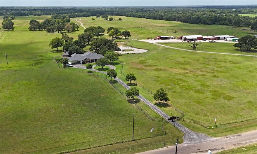 Sought-after Wills Point ranch just 45 minutes from Dallas – a rare blend of history, opportunity, and modern ranching lifestyle! Own a piece of Texas heritage surrounded by 300+ year-old trees, including the iconic Lady A, a 400+ year-old oak. This fully operational AG exempt ranch is set up for immediate use with 4 barns, multiple corrals, working pens, and cross-fenced pastures ideal for rotational grazing of cattle or horses. The ranch features 10 ponds, a fenced alleyway for efficient livestock movement, and a vet area with access to water and electric. The expansive barn includes an air-conditioned office, half bathroom, and washer & dryer, making operations convenient. The 3,192 SF main home offers luxury and comfort with serene views and thoughtful design throughout. Entertain with ease on the outdoor patio, featuring a covered kitchen, wood-fired pizza oven, and space to dine or dance under the stars. There's even an outdoor bathroom with AC for guests. Explore your land via ATVs or horses and enjoy breathtaking Texas sunsets.

Additional highlights:
Attached outdoor arena for riding or events
Multiple barns and equipment sheds
Farming equipment available for purchase
3 Additional homes and approximately 8 acres can also be purchased, ask agent for details

This property offers endless potential—from ranching and equestrian pursuits to agri-tourism, events, or private retreat living. Whether you're expanding your operation or embracing a new chapter in country life, this one-of-a-kind ranch is ready for you. Inquire with REALTOR regarding established interest with adjoining property owners to assemble the lots for optimum road frontage on CR 3910. This would be 3 additional lots for a total of 8.4 acres.