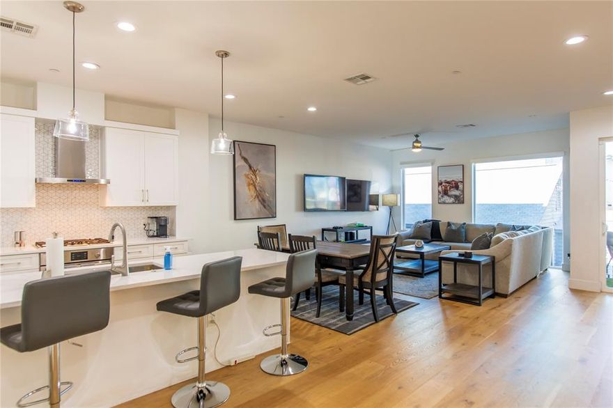 Experience elevated urban living in this modern three-story townhome in the highly sought-after Knox Henderson neighborhood. Designed with style, smart functionality, and walkability in mind, this home blends contemporary design with everyday comfort in all the right ways.

The open-concept main level is filled with natural light and clean, modern lines. The kitchen is a true standout with quartz countertops, white shaker cabinetry, geometric tile backsplash, stainless steel appliances, a gas cooktop, and a dramatic waterfall island with seating. The living and dining spaces flow seamlessly to a covered balcony, creating the perfect spot for morning coffee or unwinding in the evening.

A flexible first-floor space works beautifully as a home office, gym, studio, or guest area and includes a convenient powder bath. Upstairs, both bedrooms offer privacy and comfort, paired with designer bathrooms featuring premium tile and sleek modern finishes.

Thoughtful upgrades include motorized window shades, high-end appliances, custom cabinetry, designer tile accents, and a garage prewired for EV charging.

The HOA covers yard maintenance along with water and trash service, making this a true low-maintenance, lock-and-leave lifestyle.

Set in one of Dallas’ most vibrant and walkable neighborhoods, you are just steps from boutique shopping, dining, nightlife, and top entertainment destinations.

2222 Moser Avenue No. 111 delivers the perfect balance of style, location, and effortless living. Schedule your private tour and come experience it for yourself.