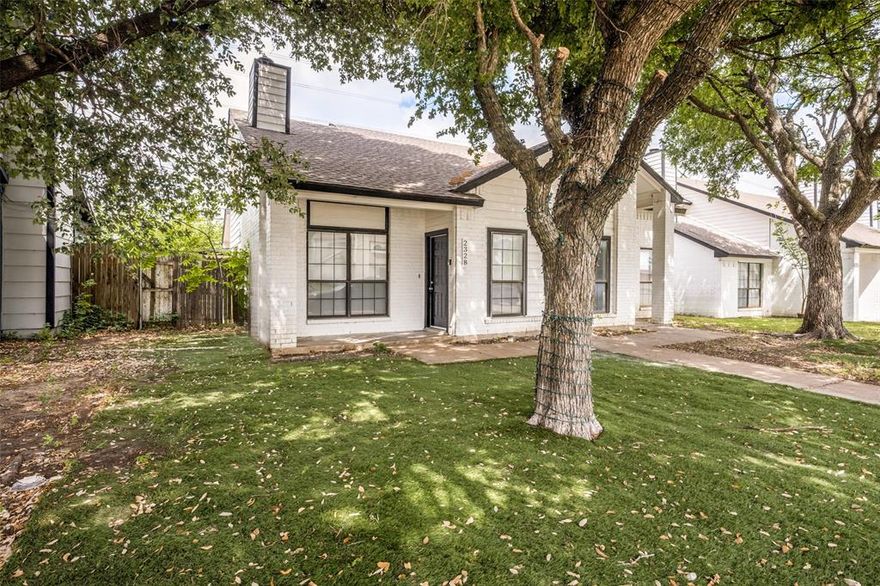 Bright and refreshed Arlington home with mature shade trees, inviting curb appeal, and a clean, move-in-ready interior. The main living area features vaulted ceilings, wood-look flooring, abundant natural light, and a cozy fireplace. The kitchen offers white cabinetry, updated countertops, black hardware, stainless steel appliances, and a functional layout connecting easily to the dining and living spaces. Spacious bedrooms include neutral finishes and updated ceiling fans, while the bathrooms feature refreshed vanities, fixtures, and tub-shower areas. Enjoy a private fenced patio plus rear covered parking with a two-car carport. Convenient location near major roads, shopping, dining, and area amenities. 

Buyer and buyer’s agent to verify all information, including schools, measurements, square footage, and property details.