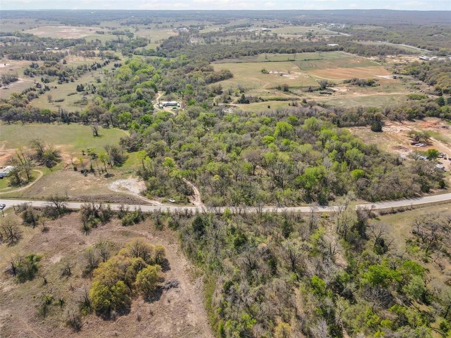 Discover the potential of this vast 353 acre parcel with excellent road frontage, offering endless opportunities for development or investment.  Enjoy the beauty of nature with an abundance of mature trees that provide privacy and create a serene environment.  With numerous prime locations throughout the property, you can create your dream home or develop multiple residences, making it perfect for builders and developers alike. Whether you're looking to create a private retreat, develop a residential community, or explore agricultural opportunities, this land offers the versatility you need.