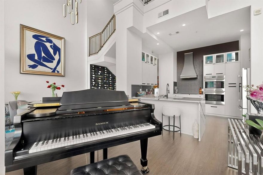 Penthouse Condo at The Terrace in Victory Park with stunning downtown views from every room as well as two balconies., voted best highrise to live in for 2025 for all of downtown Dallas. This 2 bed 2.5 bath condo just hade a total $150,000 remodel, Tons of natural light, V-Kool film on living room windows, upper window electric shades, and two terraces. Has an additional parking spoace available as well as the largest storage unit in the building. Largest two story Penthouse in the building. High end appliances in kitchen with waterfall quartz countertops and induction cooking. Spa like bathroom is an oasis to relax in. No space or amenity was spared in this incredible floor to ceiling remodel. Amenities include Concierge, Rooftop pool, Resident lounge, Outdoor dining area with fireplace and Fitness center!! Parking features 2 premium parking spaces in a secure parking garage with its own private Tesla charger. Within walking distance to American Airlines Center, Restaurants, Movie theatre, Grocery store, Katy trail and more. A must see!!  All information and measurements must be verified by Buyer