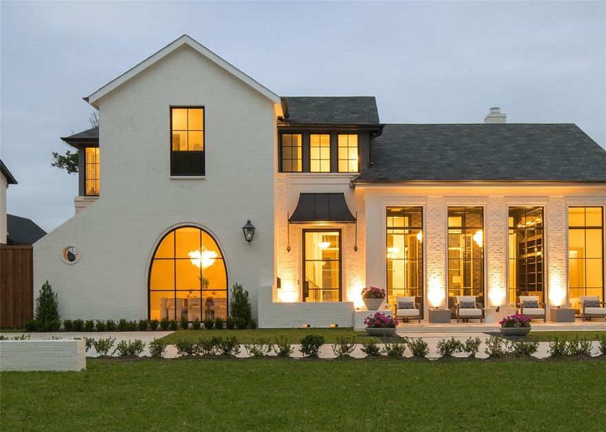 Introducing a truly exquisite residence that epitomizes luxury living. Custom built by Heritage Blue Homes, on 100x165 lot in Preston Hollow, this thoughtfully designed floor plan features 5 beds (DS Primary & Guest) 5.3 baths, each meticulously designed to offer an unparalleled level of comfort & sophistication. Stunning interior is flooded w light thanks to high ceilings, oversized windows & doors that seamlessly connect the indoor-outdoor spaces. Open living room leads to the kitchen, featuring large marble island, premiere appliances, paired w high gloss lacquered cabinetry. The ds primary suite provides a serene retreat overlooking pool & boasts a spa-like marble bathroom w 2 oversized separate closets. Upstairs has wide hallways, 3 bedroom suites, & large playroom. Outside enjoy the meticulously landscaped grounds, 2 covered terraces, retractable screens, fireplace, ceiling heaters, plus a Wolf built in grill & stunning pool-spa. 3-car garage + whole house generator.