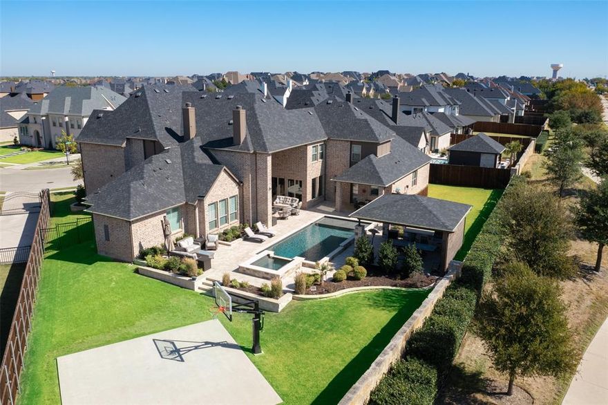 Genuinely Stunning One-of-a-Kind home! This Custom Designed Home has Everything You Desire! Each of the 6 bdrms Have Full En Suite Bathrooms.  Elegant Entry Sweeps You Into the Beautiful Home w Views of the Gorgeous Outdoor Oasis and Entertaining Space. Handsome Study w Built-In Cabinetry and Coffered Ceiling Detail. Expansive Dining Room for Holiday Meals. Showstopper Kitchen is Truly Spectacular! Gas Cooktop, Massive Island, TONS of Beautiful Cabinetry for Storage, and Glass Front Detail w Lighting. The Connection to the Massive Eat in Kitchen, Large Family Room, and Kitchen All Combine to Create an Entertainers Dream Home! Each of the Bedrooms are Oversized! Full MIL quarters w a full kitchen, living room, and washer and dryer area! The Outdoor Space is it's own Resort w Covered Cabana, Memphis Grill, Glistening Pool and Spa, Basketball Sport Court. Multiple Seating Areas, Outdoor Fireplace. MIL Quarters has it's Own Access to Backyard as well. 6 Car Garage!
See full feature list