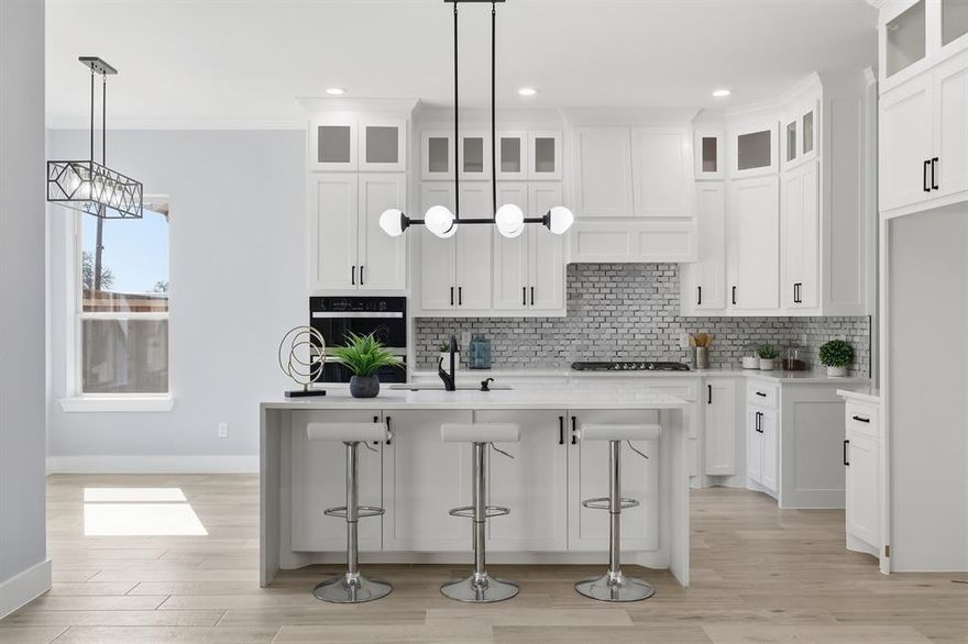 Perfectly positioned in the heart of Arlington, this stunning new construction single-story home offers modern design, thoughtful craftsmanship, and the freedom of no HOA. From the moment you arrive, the striking stone and brick exterior paired with an elegant iron front door sets the tone for the quality found throughout.  Step inside to soaring tall ceilings and a bright, open-concept layout designed for both everyday living and effortless entertaining. The living space and kitchen feature durable wood-look ceramic tile flooring, while the bedrooms are finished with stylish luxury vinyl plank for comfort and warmth. The chef’s kitchen is a true centerpiece, showcasing a large island, ceiling-height cabinetry with glass uppers, and high-quality stainless steel appliances.  Seamless indoor-outdoor living is made easy with high-end sliding doors that open to an East-facing covered patio, perfectly positioned to enjoy afternoon shade. The spacious backyard is enhanced by beautiful stone retaining walls, offering both visual appeal and usable outdoor space.  Privately situated at the back of the home, the primary suite enjoys peaceful backyard views and a spa-inspired bathroom featuring a freestanding tub within the oversized shower and rain shower heads for a truly luxurious retreat.  With 4 bedrooms, 2.5 bathrooms, refined finishes, and a prime Arlington location, this home delivers elevated single-story living with style, comfort, and exceptional attention to detail.