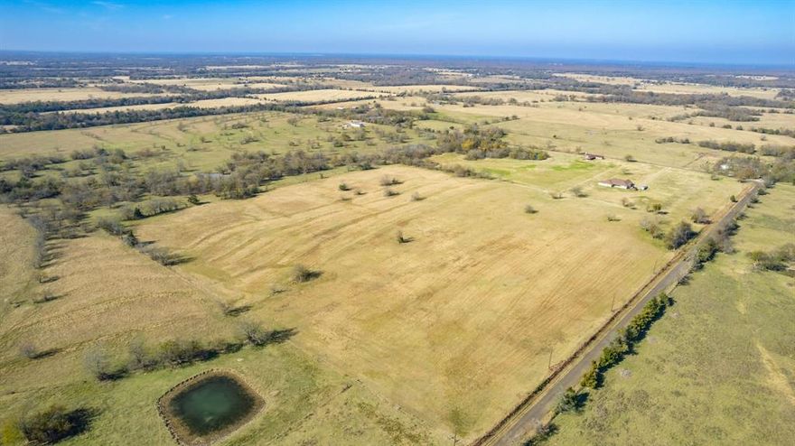 Take a look at this clean AG-exempt 11.5 acres, more or less, to be surveyed out of a larger tract. This lot has a few trees, but is mostly open pasture.  North Hopkins Water is available, plus there is power at the road. Fencing is on 3 sides. This unrestricted land in the Sulphur Bluff ISD provides plenty of options for housing. If you need more land and want a house, you can also purchase an adjoining lot (Tract 1) which comes with a 3,081 square foot home on 15 acres. The house and 15 acres (Tract 1) must sell first, prior to selling the land tracts (Tract 2--this listing & Tract 3). Keep the 11.5 acres or bundle with additional land for the space you need!