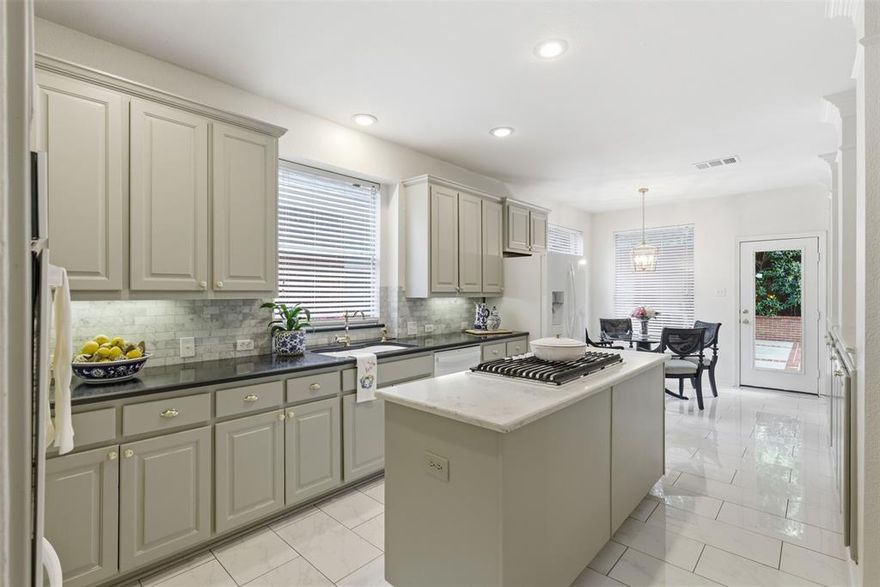 Tucked inside the gated Estates at Forest Hills community, this beautiful and fully remodeled East Dallas home blends comfort, style, and everyday livability in all the right ways. Gorgeous wood floors run throughout the first floor, while the inviting living room with a wood-burning fireplace creates the perfect cozy gathering space. The updated kitchen is equally stunning with contrasting stone countertops, gas cooking, abundant storage, and designer finishes that make the entire home feel elevated yet approachable. Upstairs, a second living area gives everyone room to spread out, whether for movie nights, a playroom, or the perfect media lounge. The spacious primary suite feels like a true retreat with a relaxing garden tub, beautiful marble tile work, dual sink vanity, and two closets designed for real life. You’ll also find two secondary bedrooms and an additional full bathroom, creating a functional layout with space for everyone. Downstairs, the flexible fourth bedroom can easily become your home office, guest room, or workout space depending on your lifestyle needs. But the real magic happens outside. The private New Orleans courtyard-inspired backyard feels like your own hidden getaway with an app-controlled heated pool and spa, gas grill connection, and an 8-foot privacy fence that makes entertaining or relaxing feel effortless. With a location just minutes from White Rock Lake, the Dallas Arboretum, Casa Linda dining and shopping, downtown Dallas, and easy access to I-30, this home truly gives you the best of East Dallas living. This is the kind of home people wait for.
