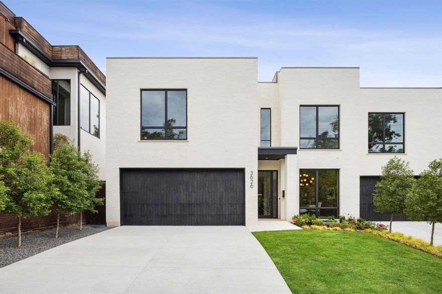 Welcome to this masterpiece of modern design and luxury nestled on a secluded corner lot. This newly constructed, contemporary duplex offers 4 bedrooms, 4 full bathrooms, and a stylish half bath, perfectly blending sophistication with comfort. A standout feature of this property is the primary suite located downstairs, a rare find in this neighborhood, providing both convenience and luxury.  Step inside to a serene oasis, created by Brant McFarlain Design, where a neutral color palette and expansive windows flood the downstairs with natural light. The versatile office or flex space is ideal for working from home, while the inviting living room, complete with a cozy gas fireplace, sets the stage for relaxation and entertainment. The heart of the home, a chef's dream kitchen, features top-of-the-line Wolf appliances, ample wine storage, and a walk-in pantry. Embrace indoor-outdoor living with a covered terrace that overlooks a serene plunge pool, perfect for unwinding after a long day. Venture upstairs to find an exercise room and another spacious living room equipped with a wet bar, making it the ultimate entertainment hub. All guest rooms are thoughtfully located on the upper level, ensuring privacy and tranquility. The primary suite is a true sanctuary, with its ensuite bath, complete with his and her walk-in closets, and a separate walk-in shower and soaking tub. Located just moments from Highland Park Village, Katy Trail, and Knox-Henderson, this home offers unparalleled convenience and luxury. Experience the perfect blend of modern sophistication and timeless comfort in this exquisite property.