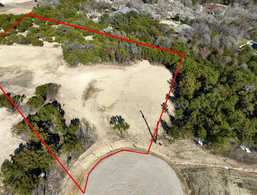 This 2 acre lot feels huge! Plenty of privacy all around, at the end of a cul-de-sac and plenty of space for a shop or whatever else you plan on using acreage for. Discover the charm of Freeman Ranch, a serene country community situated just 5 minutes from the Ric Williamson Loop in the heart of Parker County. This picturesque development boasts a large seasonal pond at the community's rear, enhancing the natural beauty of the area. In Freeman Ranch you have several options - Use Trinity to build your dream home, bring your own builder or buy a lot to hold until building meets your time frame. Each lot is fully equipped with modern amenities including fiberoptic cable, well-maintained roads, and reliable electric services, ensuring a perfect blend of rural tranquility and contemporary comforts. Animals, livestock, horses, chickens, barns, sheds etc are all welcome! Build your dream home in Weatherford, a city celebrated for its Southern charm, Texan hospitality, and rich cultural heritage.