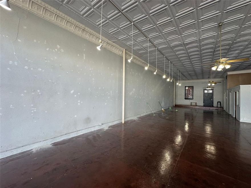 Endless possibilities. Rectangular space (~28 feet wide by ~78 feet long) with two bathrooms and an office space.  Spectacular window space for display. Excellent walk-by and drive-by traffic.  Long-established businesses on each side and across the street provide good anchoring for this location.