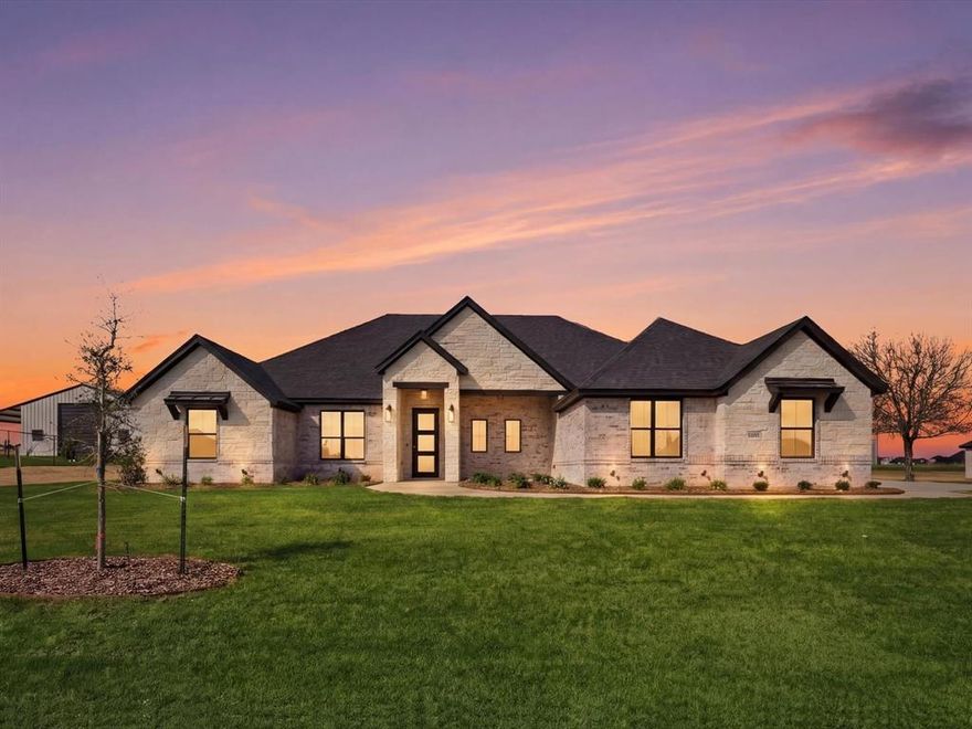 BUILDER INCENTIVE $10,000 CLOSING COSTS! Brand new Al Couto Homes custom-built in Weatherford’s Elevation Estates, offering the space, layout, and upgrades designed for modern Texas living. Situated on a full 1-acre lot, this new construction home features an open-concept floor plan ideal for both entertaining and everyday life. The spacious living room welcomes you with soaring ceilings, coffered ceiling detail, abundant natural light, and a dramatic floor-to-ceiling fireplace. The chef’s kitchen anchors the home with a stunning quartz waterfall island, custom stained cabinetry, quartz countertops, stainless steel appliances, and a large walk-in pantry designed for both function and storage. The private primary suite offers a spa-inspired retreat with a freestanding soaking tub, oversized walk-in shower, dual vanities, and a large walk-in closet with built-in shelving. Secondary bedrooms are generously sized and thoughtfully arranged in a split-bedroom layout for added privacy for family or guests. Additional features include a dedicated home office, spacious laundry room with storage, wood-look tile flooring, crown molding, spray foam insulation, and quality craftsmanship throughout. Step outside to the covered back patio overlooking the expansive backyard, offering endless potential for a pool, shop, outdoor kitchen, or future workshop. Located in one of Weatherford’s growing acreage communities, residents enjoy no HOA, no PID, no MUD, and low property taxes while still being a short drive to shopping, dining, and major highways.