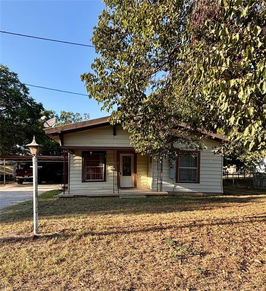 Located on a quiet street in Eastland this three bedroom, two bathroom home sits on two lots providing ample outdoor space.  Outside, you will also find an attached two car garage and two storage buildings offering plenty of space for tools, hobbies, or seasonal items.  The living room and dining room both have great built-ins and the kitchen comes with all the appliances.