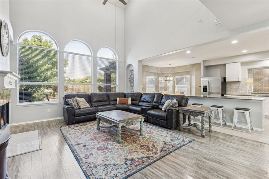 Welcome to 10217 Vintage Drive, a beautifully maintained residence offering space, comfort, and everyday convenience in a prime location near sought-after amenities. Built in 2007 and offering approximately 3,187 square feet, this inviting home features a thoughtful layout with five bedrooms and two-and-a-half baths, creating room to relax, work, or gather with ease. The main level opens to a bright living area with large windows that frame peaceful views of the manicured practice field directly behind the home—an expansive green space perfect for outdoor recreation, kite-flying, or simply enjoying the open landscape. A private gate in the back fence provides direct access, extending your outdoor living options. The kitchen serves as the heart of the home, offering abundant cabinetry, generous prep space, and an easy flow into the dining and living areas. Nearby, the spacious downstairs suite includes a large bath with dual vanities, a separate shower, and a walk-in closet. Upstairs, four additional bedrooms and a versatile game room offer flexible use for hobbies, study areas, or quiet retreats. Residents appreciate the exceptional community amenities and the convenience of being within walking distance of the pool, playground, tennis courts, basketball courts, and scenic walking paths. The location also provides quick access to shopping, dining, and major corridors, making daily routines simple and efficient. The surrounding area continues to grow and thrive, adding even more appeal for those seeking both comfort and long-term convenience. With its inviting layout, peaceful backdrop, and desirable neighborhood setting, 10217 Vintage Drive offers a wonderful blend of comfort, usability, and location. It has been cherished by its current owners for its warm character, generous space, and easy connection to outdoor activities—an ideal place to enjoy for years to come.