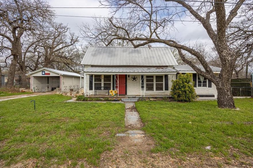 Vintage, that's the word for this quaint place! One of a kind Craftsman with Colonial style home! 1920 build of history, original stone built outdoor fireplace and tall stone old well! City water and sewer! Three bedrooms, 2 bathrooms, wood designed look laminate flooring, how many 1920 builds do you know with 2 full bathrooms! Beautiful big trees, large covered front porch and stone walk paths to the back patio! So unique, you just have to come view it, to believe it! There was already so much remodel done for you, but let the dreams begin for more if you choose!