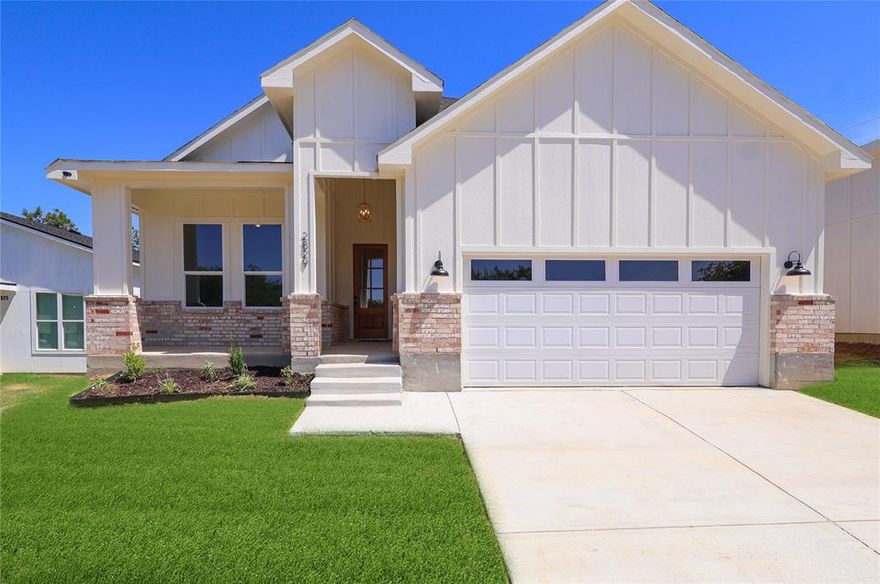 Welcome to your dream home where modern design meets everyday comfort. This stunning 4 bedroom, 2 bathroom residence offers the perfect balance of style, functionality, and warmth, ideal for both entertaining and daily living. Step inside to an inviting open concept layout that seamlessly connects the living, dining, and kitchen areas. The heart of the home is a beautifully designed kitchen featuring elegant quartz countertops, sleek stainless steel appliances, and abundant cabinetry perfect for hosting or enjoying quiet nights in. The spacious living area is filled with natural light, creating a warm and welcoming atmosphere for gatherings with family and friends. Retreat to the private primary suite, a true oasis complete with a generous walk-in closet and a spa-inspired en suite bathroom featuring modern finishes designed for relaxation. Three additional bedrooms provide versatility for family, guests, or a home office, while the thoughtfully designed secondary bathroom ensures convenience for all. A dedicated laundry room and a mudroom located just off the garage add everyday practicality. Located just minutes from downtown Fort Worth, you’ll enjoy easy access to top dining, shopping, and entertainment, along with convenient access to major highways. A perfect blend of location, design, and comfort—this one is a must see!