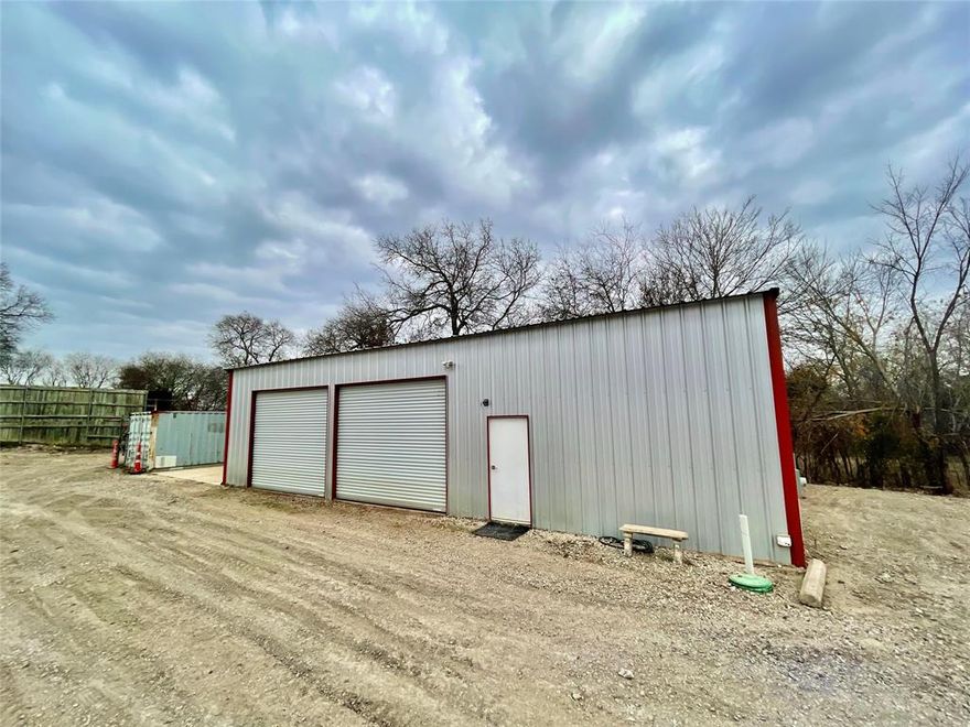 Located near the intersection FM 121 and FM 2729, this versatile property is just minutes from Highway 75 and the city of Van Alstyne, but is still located outside of city limits. The workshop is a 30x50 spray foam insulated shop that features 3 roll-up doors and a 540 sq ft recently remodeled, climate controlled office area. Set up your office or living quarters in a space that includes new drywall, paint, and recessed lighting. The office area includes the convenience of a bathroom complete with a shower. The shop area has 3 large roll-up doors and the exterior of the building has a 20x30 concrete pad along with a 40' shipping container with barn doors that allow weather covered storage or additional workspace. The rocked lot allows plenty of parking for customers, trailers, equipment, or storage.
There is additional quarter acre also for lease with an eye catching second building made from a high cube shipping container has spray foam insulation behind the level 4 finished drywall. It also features gallery recessed lighting, multiple 8' glass doors, and a mini-split that can heat or cool the building. Utilize the additional 15x40 covered patio area in the front of the building for events or to extend the usable space.