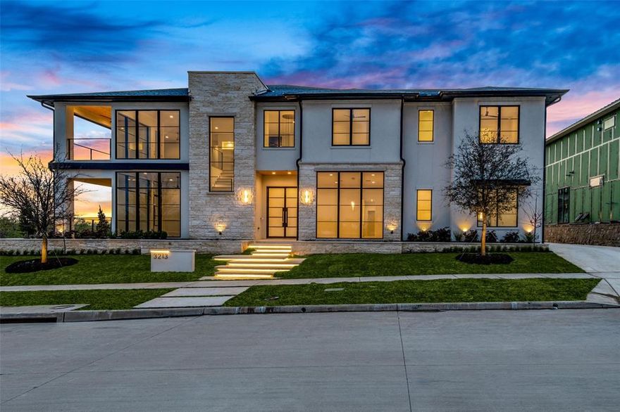 Modern Architecture w. Glam finishes. Overlooks Pond &  Greenbelt across street. 7024 Sq. Ft., 5 BR, 5.3 Bth, 4 Car Gar, and POOL. Lot Sz. 0.32 Acre.  Custom Iron Entry Door  w. Glass & Brass Hardware to Stunning Foyer Entry w. Brass Stair Spangled Chandelier w. view of Temperature Controlled Glass Wine Display + Formal Dining with Glam Gold Chandelier. Study w. Paneled Lacquered Architectural Wall Detail overlooking patio. Family Room with Calacatta Marble Fireplace Surround. Gourmet Kitchen with Brass Vent Hood, Slab Backsplash, White Shaker Cabinetry, Professional Appliances & Butler's Pantry. Master with Architectural Wall Feature, Luxury Spa Bath, & Oversized Closet. Guest Bedroom & Ensuite Bath Down. Two Utility Rooms. Up Gameroom & Bar with Emerald Teal Cabinetry  & Covered corner Balcony. Media has Grand Entrance Wall featuring Designer Double Doors flanked by Gold Display Shelving. Exercise Room, Kid Study, 3 Ensuite BR's. Covered Outdoor Living with Kit. & Fireplace.