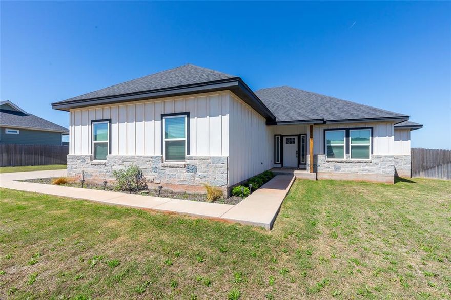 Beautiful 1 owner custom built home with VIEWS VIEWS VIEWS! Photos do not do this one justice!! With a half acre lot that is fully irrigated with sod and sprinkler system you're gonna need a riding mower! This custom floor plan is a 3 bed 2 bath with an XXL 2 car garage so big you can fit 3 small cars in there if you've got the parking skills. Also the garage was built with 10' ceilings and reinforced for a car lift (not included). Quiet neighborhood thats only 12 minutes from Abilene, outside city limits so you save a lot of money on your property taxes, plus the very desirable JIM NED ISD! Act fast this one won't last!!