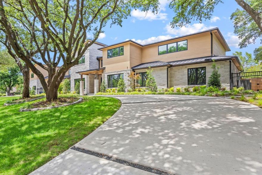 Experience the pinnacle of luxury and innovation in this completely reimagined single-story estate nestled beneath a canopy of mature Live Oaks in the coveted Preston Trails community. Set on more than an acre, this architectural masterpiece was taken down to the slab and rebuilt to the highest standards, blending sophisticated design with cutting-edge efficiency. Every inch of the home is thoughtfully curated—from full foam encapsulation and attic dehumidifiers to tankless water heaters, an electric vehicle charger, and comprehensive surveillance wiring. The state-of-the-art Lutron system seamlessly integrates smart home automation throughout.  The chef’s kitchen features top-tier SubZero, Wolf, and Cove appliances-- including two dishwashers--and opens to a stunning great room with 30-foot sliding glass doors. These retract to reveal an expansive 46-foot covered patio designed for all-season entertaining, complete with a stone fireplace, electric screen shades, built-in grill and ice maker, pass-through bar, outdoor shower, and dedicated pool bath with storage. The resort-style backyard has lush landscaping, open grassy areas, and a brand-new 40-foot pool and spa with  equipment that is housed in an enclosed structure for protection from the elements.  The luxurious primary suite features a cozy den with fireplace and built-ins, a morning bar with beverage fridge, a private screened patio, and a spa-inspired bath adorned with Taj Mahal quartzite. Four spacious secondary bedrooms each include an ensuite bath and custom walk-in closets. Additional highlights include a large entertainment room, private office with built-in safe room, wine room, powder bath, and an oversized utility room. Upstairs, a framed 4,000-square-foot walk-out attic with pre-installed plumbing and electrical offers unlimited expansion potential.