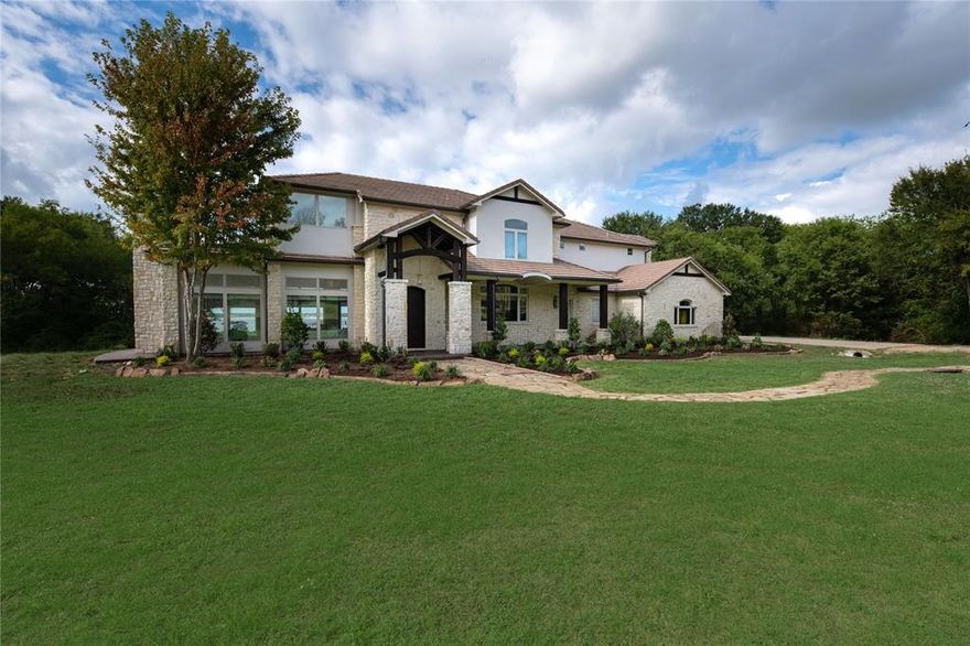 Nestled within the prestigious 505 Ranch Club on Cedar Creek Lake, a short 45-minute drive from Dallas, this remarkable 6.4-acre estate embodies luxury living at its finest. Boasting an elegant 5-bedroom home, each with its ensuite bathroom, and a versatile gameroom bunk room, this property offers an exceptional level of comfort. Step outside to your very own paradise, complete with a sparkling pool, expansive outdoor patio featuring a cozy fireplace, and a fully-equipped outdoor kitchen, perfect for entertaining friends and family year-round. This estate also includes a private stocked pond with a fishing dock. For those who love water activities, a private boat dock with two lifts awaits your watercraft, ensuring you can set sail whenever the mood strikes. This property represents the pinnacle of ranch-style waterfront living. Experience the serenity of lakeside living within the gated 505 Ranch Club community while being just a stone’s throw away from the vibrant energy of Dallas.