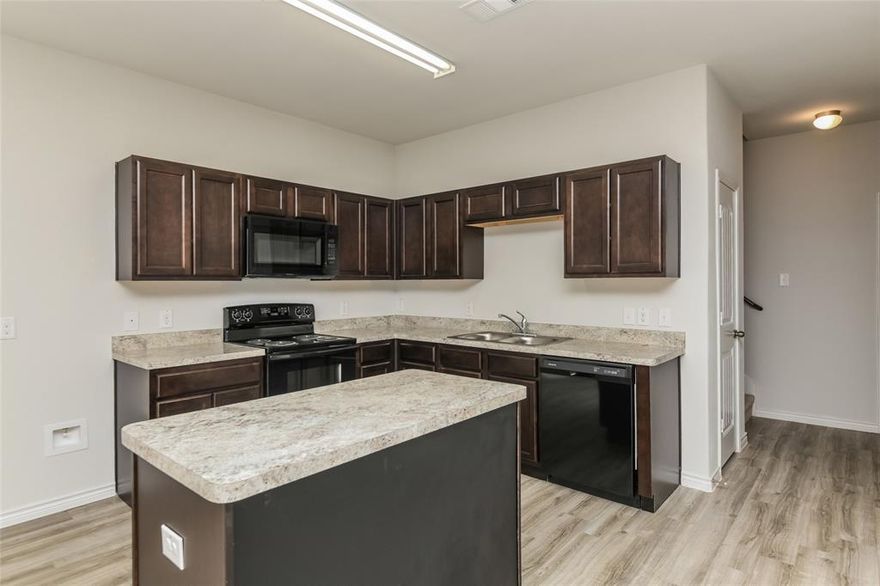 Welcome to the new two-story townhome plan, featuring 1,999 square feet, 3 bedrooms, and 2.5 bathrooms. This townhome has an open floorplan with a very large living area, with views into the kitchen and dining area. For your convenience there is a half bath downstairs, great for guests. Upstairs you will find the master bedroom, as well as the other 2 bedrooms. The master bedroom is very spacious and has an enormous walk-in closet. The laundry room is also located upstairs for convenience. This home has everything you need and more to feel at home. Features wood-grain vinyl plank flooring, two car garage, fenced backyard, and a sprinkler system. All homes are SimplyMaintained for a $100 monthly fee that includes front and back yard lawn care and exterior pest control. Cardinal Townhomes is a quiet and welcoming neighborhood in Ennis, TX, offering easy access to Highway 287 for smooth commutes. The community is part of the Ennis Independent School District, providing great schools nearby. Residents enjoy local dining and shopping, with the nearby Ennis Bluebonnet Trails offering scenic beauty and outdoor exploration each spring. With its relaxed atmosphere and convenient location, Cardinal is ideal for those seeking a peaceful suburban lifestyle.