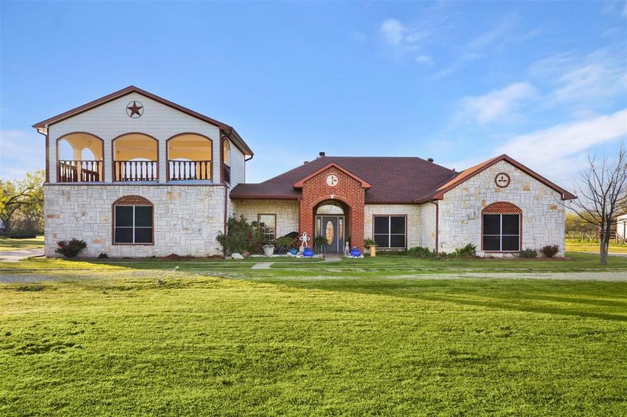 If you're looking for acreage that offers a blend of great location, a place for all of your animals to roam, a beautiful home, and a place for your home business then look no further, you've just found the perfect property!   This gem of a property is located very near Hwy 175, within minutes of Wal Mart, the hospital, and the historic downtown square in Kaufman.  The 14.07 acres is fully fenced with a gated entry, has a barn with stalls and a tack room, a loafing shed, a round pen, workshops, hobby shops, dog runs, a pond, & it is Ag Exempt.  There's a one car garage with 2 bays, and above the garage is the most amazing entertainment area, perfect for hosting any type of function - birthday parties, weddings, or just plain sunset watching.  The possibilities for this area are endless.  The home is tiled throughout, and the gray accent paint is stunning.  When touring the home, make sure to look up, the ceilings in the living room and master bedroom are unique, and add a definite wow factor.  The stone fireplace and wood mantel in the living area make for the perfect cozy night at home.  After a long day of work, head to the master bathroom to take a relaxing bath in the jetted tub.  It's your own private resort in the privacy of your own home.  This is a must see.  This property won't last long, so schedule your tour today.